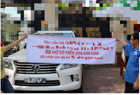 Treo băng rôn đòi nợ 200.000 USD tại TP.HCM (chờ TBT duyệt)