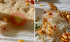 Cô gái mua hộp bánh, đang ăn thì buồn nôn khi nhìn thấy thứ lúc nhúc trên miếng chả