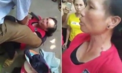 Người dân dí dao vào cổ một phụ nữ vì nghi ngờ bắt cóc trẻ em