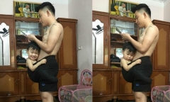 Dân mạng ''phát sốt'' với em bé thích chui vào quần bố ngồi mới chịu ngủ