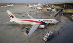 Máy bay mất tích: Cổ phiếu Malaysia Airlines giảm 4\% trong tuần