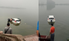 Nhầm chân ga, người phụ nữ chở hai con nhỏ lao thẳng ô tô xuống hồ Tây