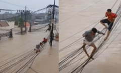 Clip: Người dân đu dây điện thoát thân khỏi