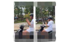 Xác minh clip người đàn ông vừa đi xe máy vừa xem điện thoại, 