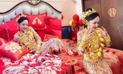 Cô dâu xinh đẹp đeo vàng khắp người, nằm trên đống tiền hàng trăm cọc khiến dân tình “đỏ mắt” ghen tỵ