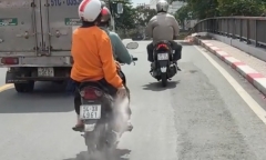 Xác định danh tính người phụ nữ ngồi sau xe máy rải 