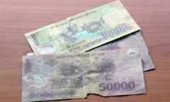 Tiền bị cháy có mang ra ngân hàng đổi được không?