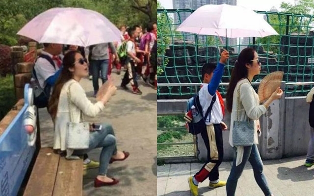 Trung Quốc: Học sinh cầm ô che nắng cho cô suốt buổi dã ngoại