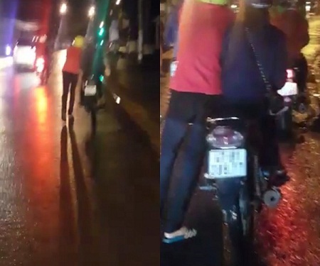 Clip chàng trai dắt xe giữa trời mưa để bạn gái ngồi trên yên gây tranh cãi