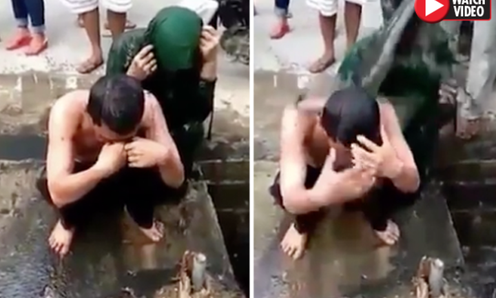 Video: Cặp đôi bị tố ngoại tình ngồi im để dân làng dội nước cống lên đầu