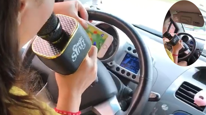 Clip: Thót tim xem cô gái vừa lái ô tô vừa hát karaoke giữa đường phố đông đúc