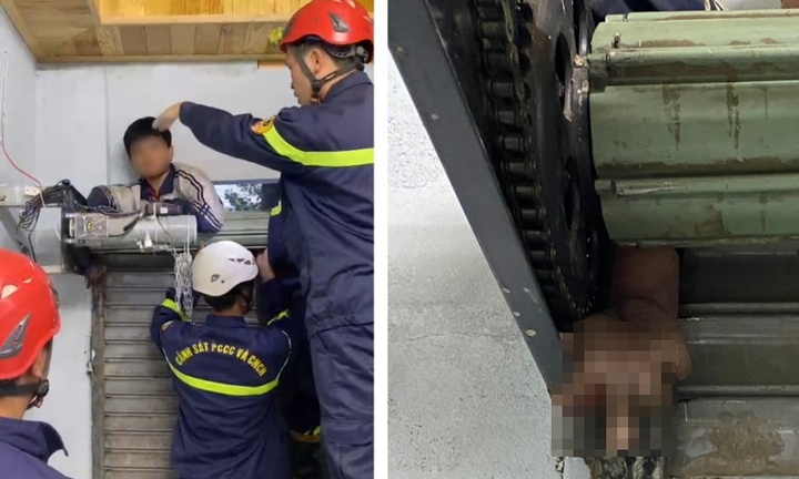 Phá cửa cuốn gỡ tay cháu bé 11 tuổi bị kẹt