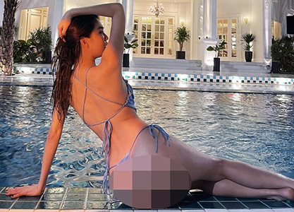 Ngọc Trinh diện bikini nhỏ xíu bên hồ bơi, phô diễn vòng 3 