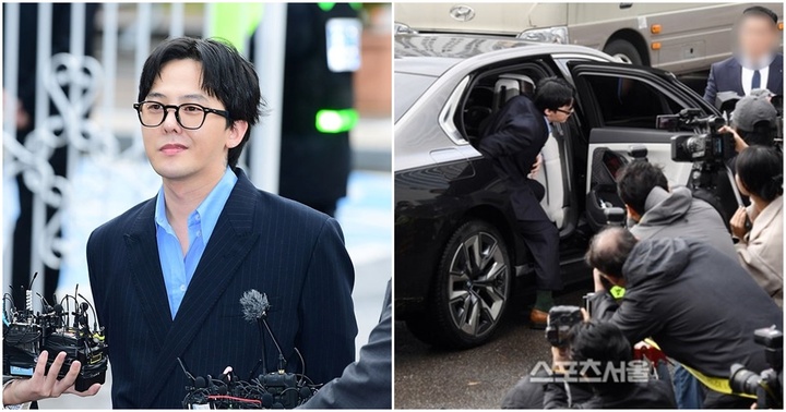 G-Dragon cười nhếch mép trong buổi trình diện cảnh sát hậu bê bối ma tuý