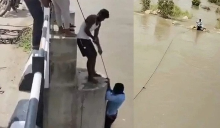 Clip: Người đàn ông bất ngờ rơi xuống sông khi đang chụp ảnh với vợ, may mắn thoát nạn trong gang tấc