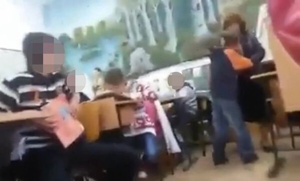 Phẫn nộ học sinh không chép kịp bài bị cô giáo tát