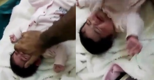 Phẫn nộ trước cảnh người bố nhẫn tâm đánh đập con gái sơ sinh vì khóc quấy