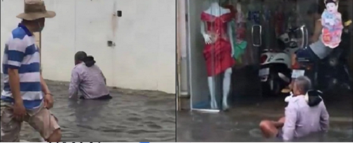 Sự thật phía sau hình ảnh cụ ông tật nguyền dùng tay băng qua dòng nước lớn