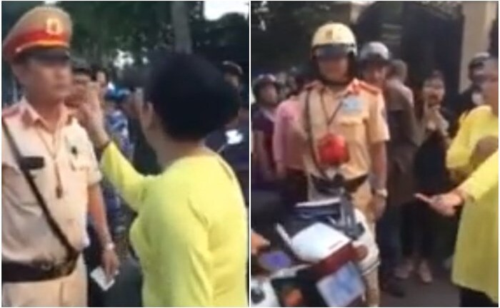 Người phụ nữ chống tay chửi bới, xúc phạm CSGT khi chồng bị giữ xe