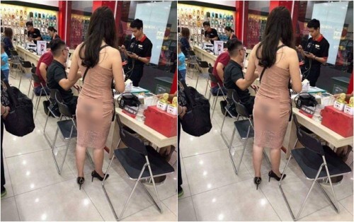 Ngán ngẩm hình ảnh thiếu nữ diện đồ bó sát, lộ hết cả nội y trong cửa hàng điện thoại