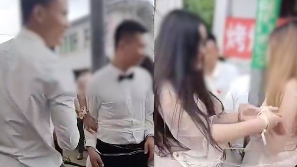 Bị trói vào cột cùng 3 phù dâu rồi ăn đòn tới tấp, chú rể không tức giận, còn nói một câu gây sửng sốt