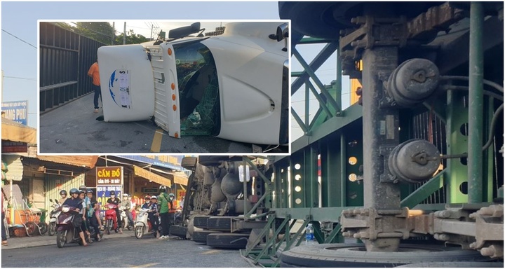 Xe container lật ngang giữa đường, tài xế đập cửa thoát thân