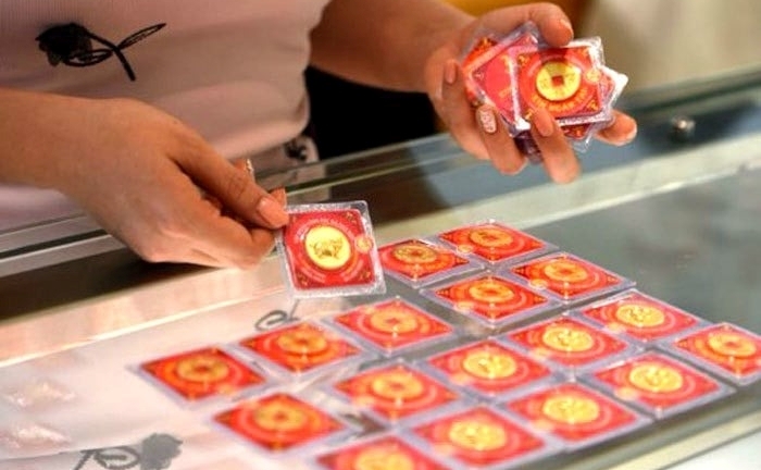 Vì  sao có tục mua vàng ngày vía thần tài?