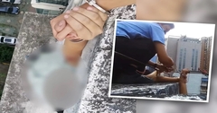 Nam cảnh sát tự còng tay mình để cứu người đàn ông định  "làm chuyện dại dột "