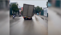 Thót tim cảnh xe tải liều lĩnh đi trên phố với  "tư thế kỳ lạ "
