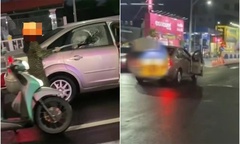 Xác minh clip người phụ nữ đi xe máy hung hãn  "tạt đầu ô tô, đập bể kính xe "