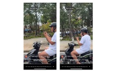 Xử phạt nam thanh niên đi xe máy thả hai tay vừa xem điện thoại, vừa xỉa răng