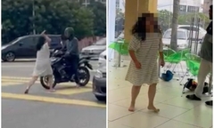Clip: Nữ tài xế cầm dao tấn công người khác, gây náo loạn trên phố sau va chạm giao thông ở Malaysia