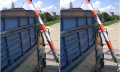 Xe tải tông đổ gác chắn tàu, rơi trúng người phụ nữ đi đường