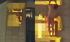 Người đàn ông treo lơ lửng trên biển hiệu khách sạn, dân tình nghi ngờ bị vợ bắt ngoại tình