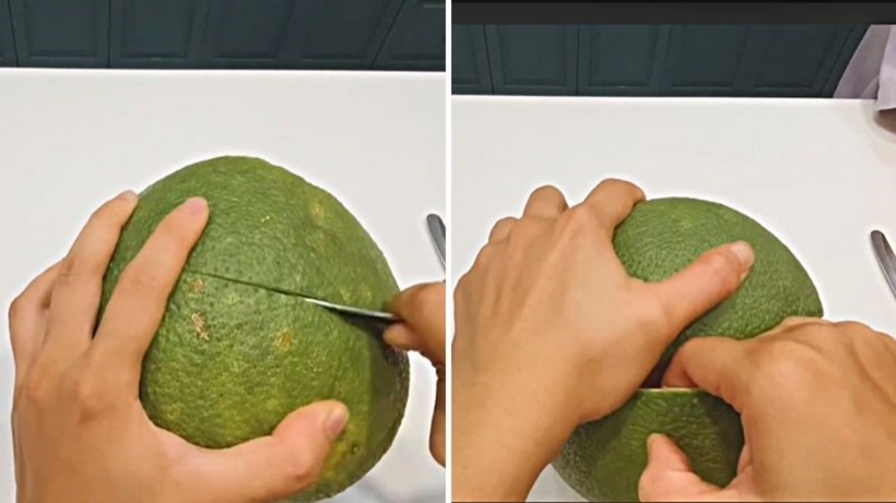 Tách vỏ bưởi thật khéo léo.