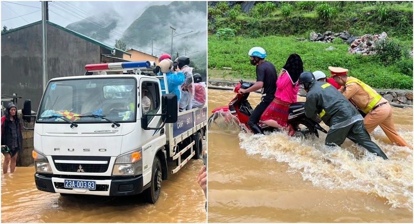 CSGT đẩy xe, dùng xe chuyên dụng đưa du khách qua điểm ngập. (Ảnh: Công an)