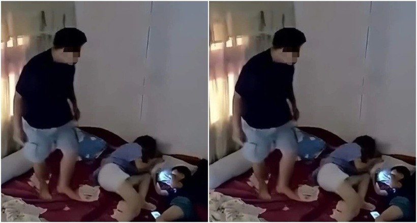 Hình ảnh B. bạo hành vợ trước mặt con trai. (Ảnh cắt từ clip)