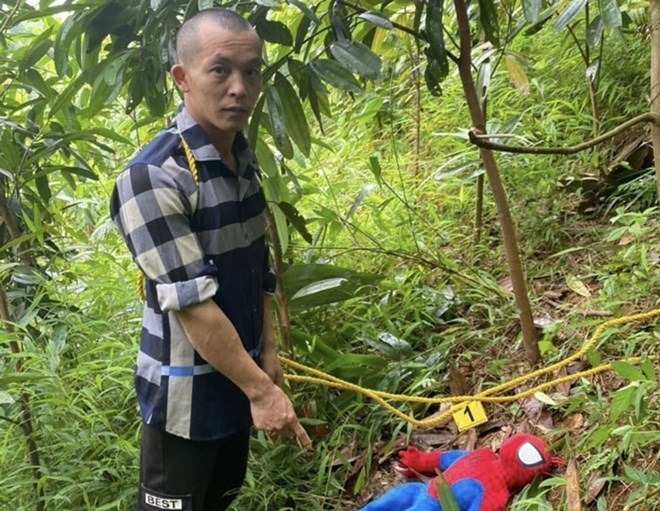 Đối tượng Bàn Văn Họp tại buổi thực nghiệm hiện trường. Ảnh: Lao Động