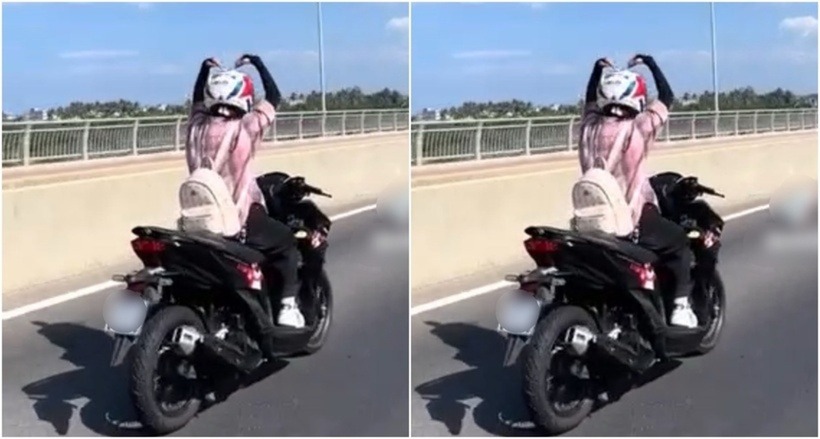 Cô gái tạo hình trái tim khi điều khiển xe qua cầu Thạch Bích. (Ảnh cắt từ clip)