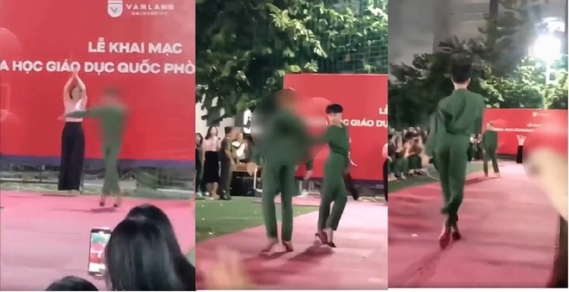 Hình ảnh nam sinh mặc đồ quân sự đi giày cao gót catwalk, đằng sau là phông nền của buổi lễ khai giảng của Trường ĐH Văn Lang gây xôn xao. Ảnh: Tiền phong
