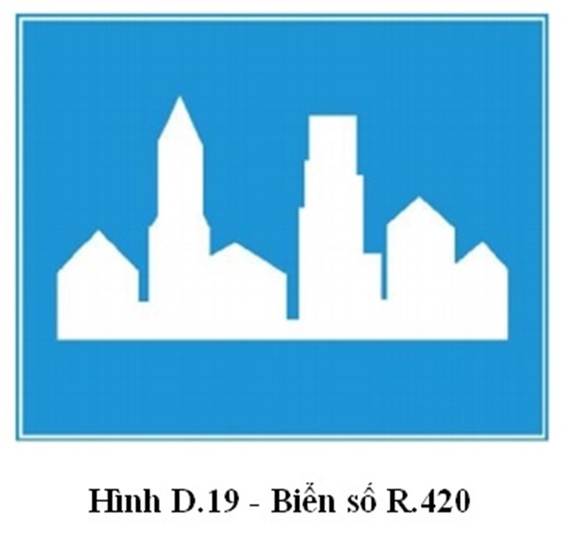 Biển báo khu dân cư có nền màu xanh, hình vẽ bên trong màu trắng.