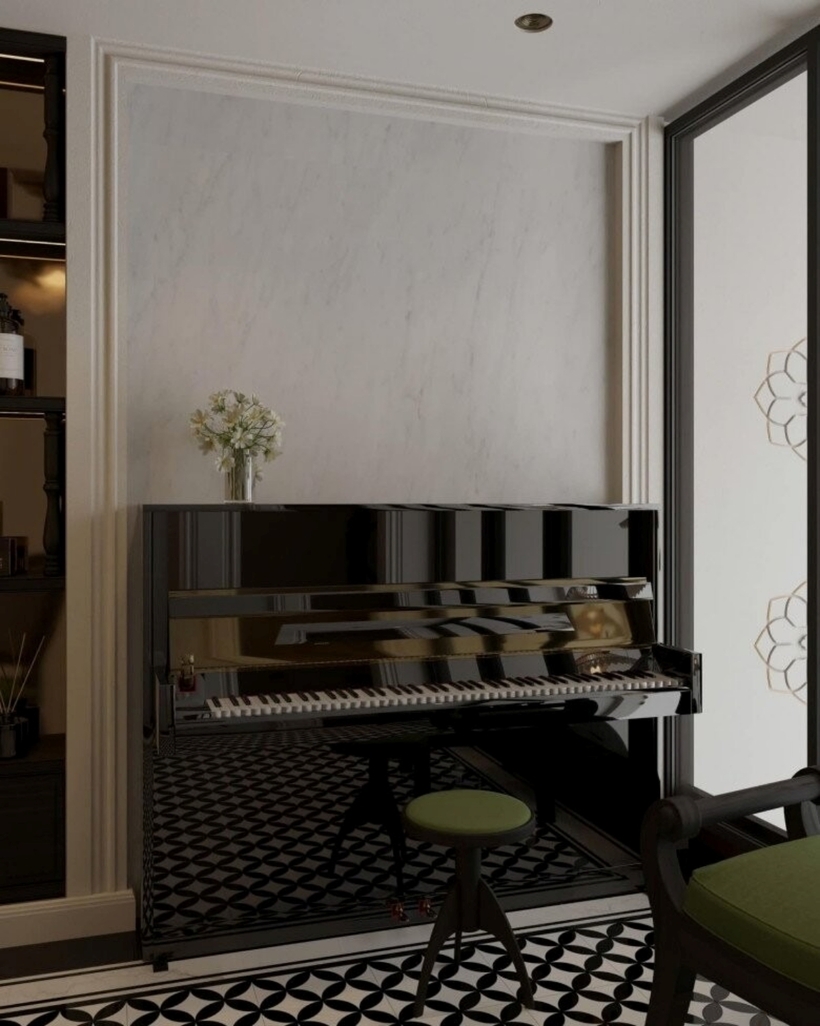 Góc thư giãn đặt chiếc đàn piano đen bóng loáng, nổi bật giữa nền gạch hoa văn đen trắng. Ghế piano màu xanh lá mát mắt kết hợp với bình hoa nhỏ đặt trên kệ, đem đến không gian nghệ thuật nhẹ nhàng, thư thái.