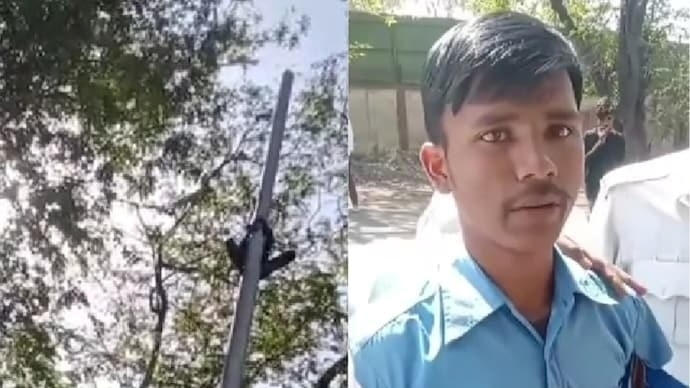 Omprakash Patel trèo lên cột điện để tránh bị phạt. Ảnh: India Today