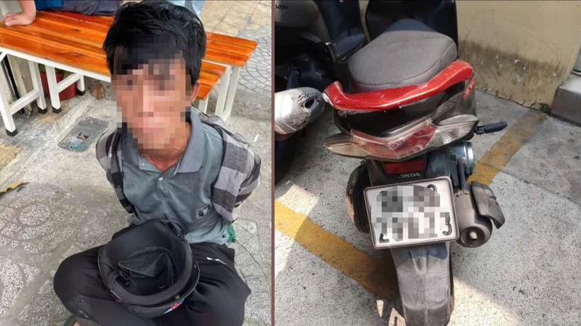 "Hiệp sĩ" cùng người dân vây bắt người đàn ông sống lang thang trộm xe máy ở TP.HCM. Ảnh: Pháp luật TP.HCM