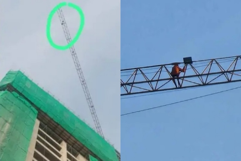 Người dân hốt hoảng khi nhìn thấy một bóng người đang di chuyển trên đỉnh một chiếc cần cẩu cao vút. Ảnh: Hoa học trò.