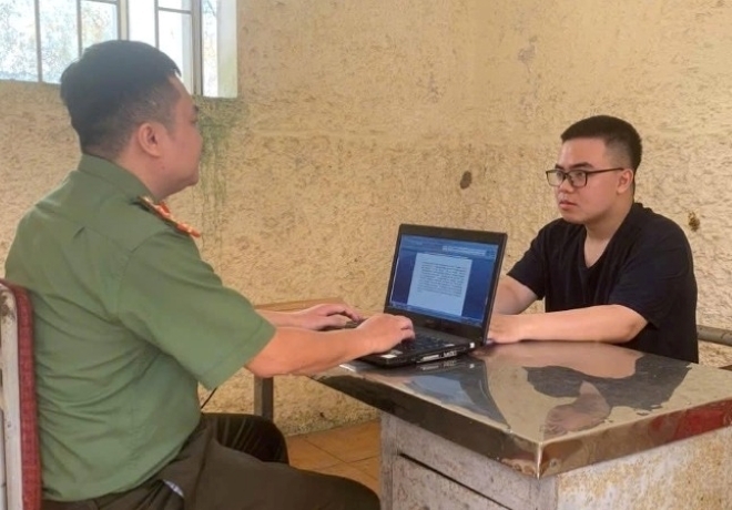 Trần Quang Huy tại cơ quan điều tra. Ảnh: VOV