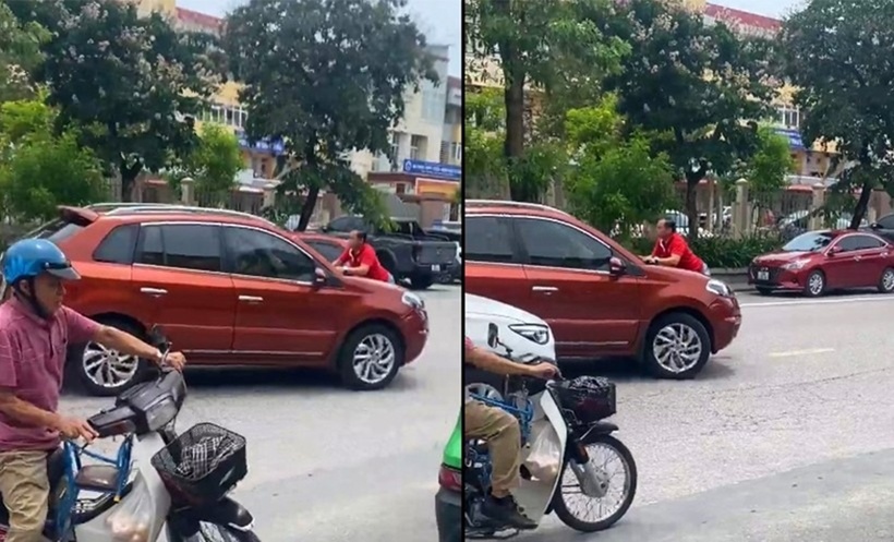 Người đàn ông bám đầu ô tô khi xe đang chạy gây chú ý và được người dân ghi lại. Ảnh: Báo Xây dựng.