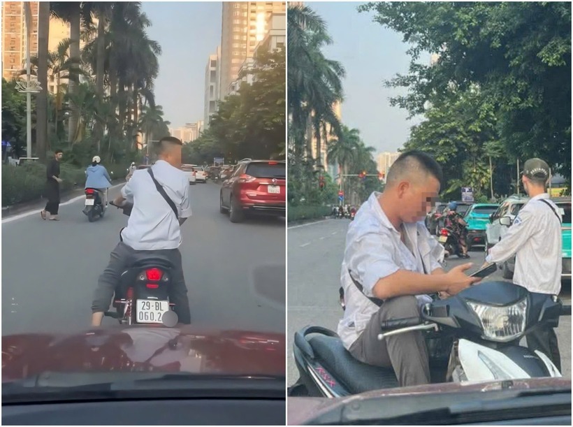 Người đàn ông mặc áo trắng, không đội mũ bảo hiểm, đứng giữa đường Hàm Nghi, phường Từ Liêm, chặn ôtô của người dân. Ảnh: Báo Dân việt.