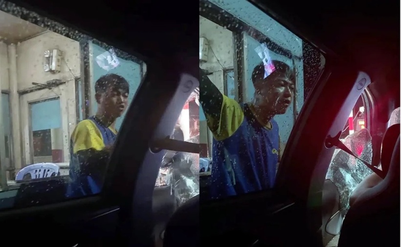 Nam thanh niên hung hãn đạp bể kính xe taxi ngay giữa đường. (Ảnh: PLO)