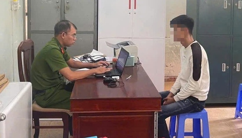 Q. tại cơ quan công an. Ảnh: Người lao động